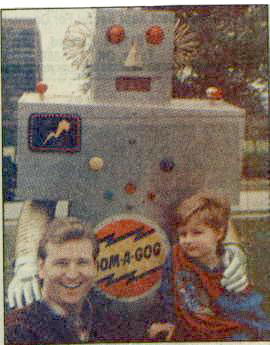Billy James Hargis II and son Billy James Hargis III with Oom-A-Gog, Tulsa television's favorite robot of years past.