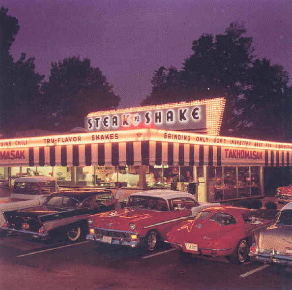 Classic Chevies adorn the 'curb' of a Springfield, Missouri Steak n Shake on historic Route 66 (©1993 by Cindy Lewis Photography)